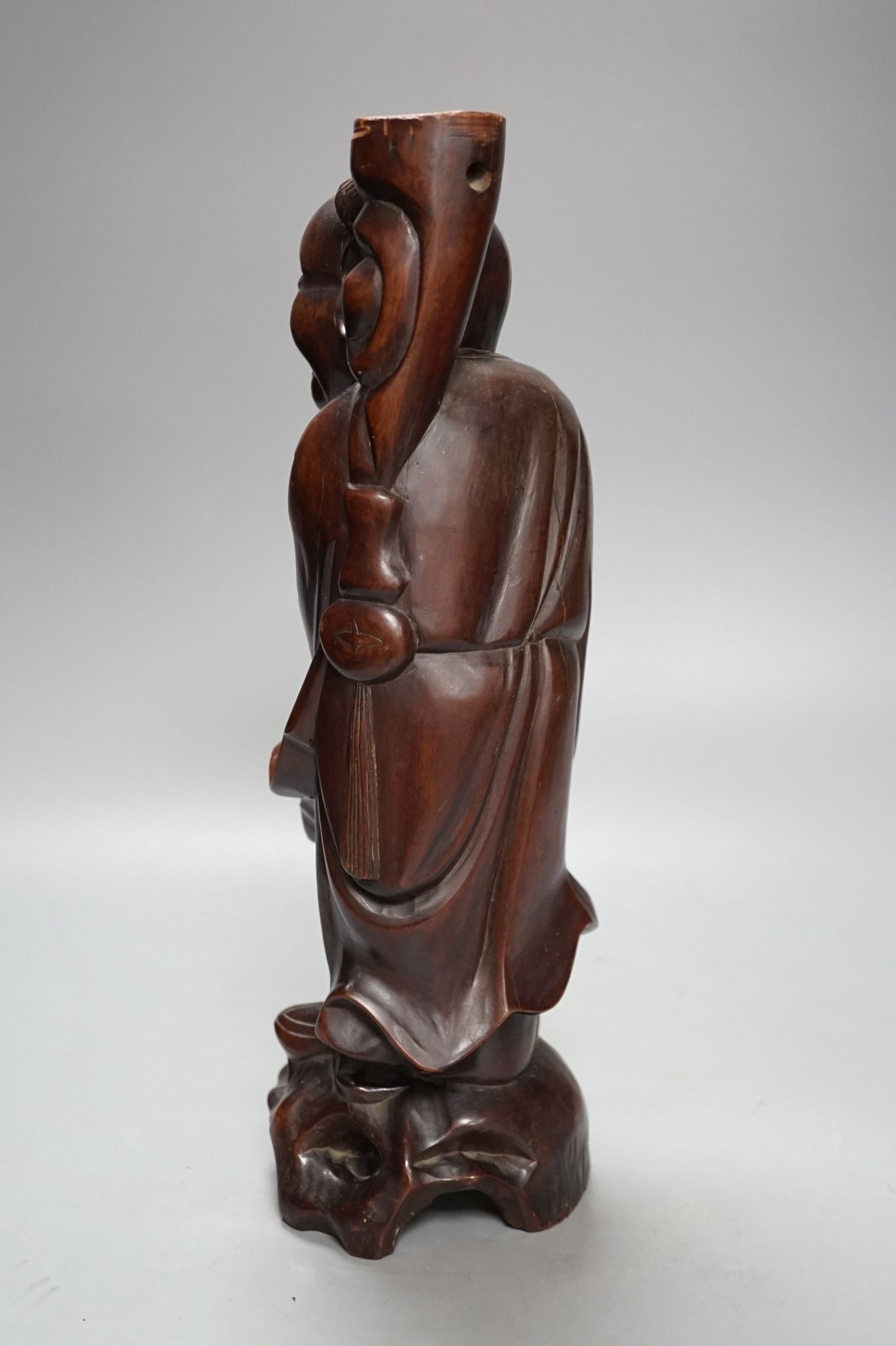 A Chinese hardwood figure of an immortal, 36cm